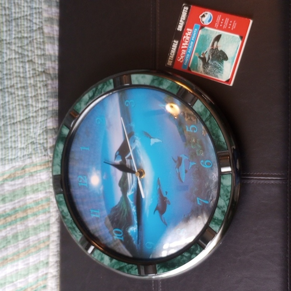 Vintage Orca clock with SeaWorld photo album souvenir